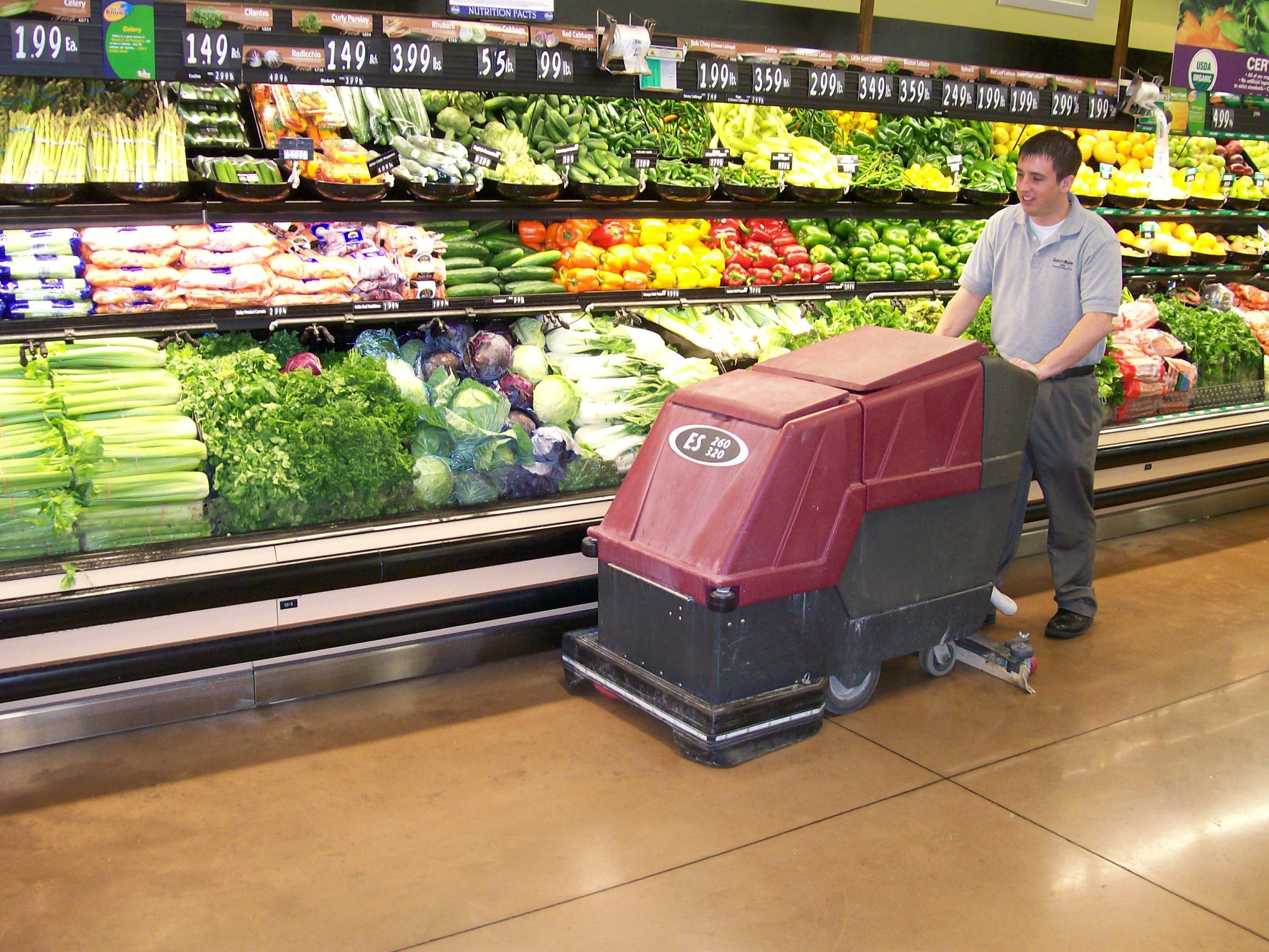 commercial floor cleaning being done in grocery store