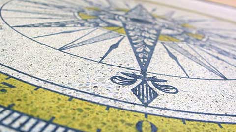 decorative dyed concrete floor with compass design