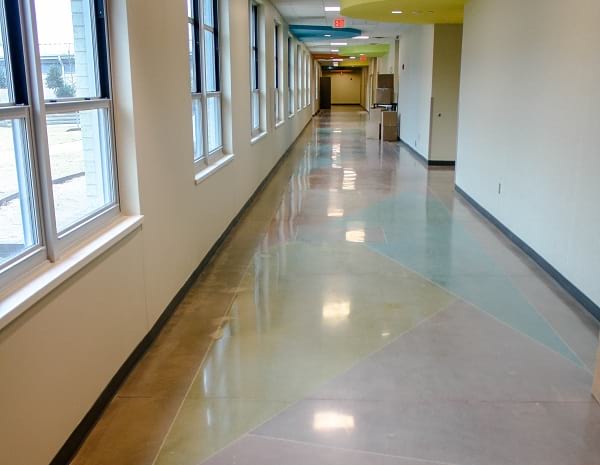 dyed decorative polished concrete flooring used in hallway of school